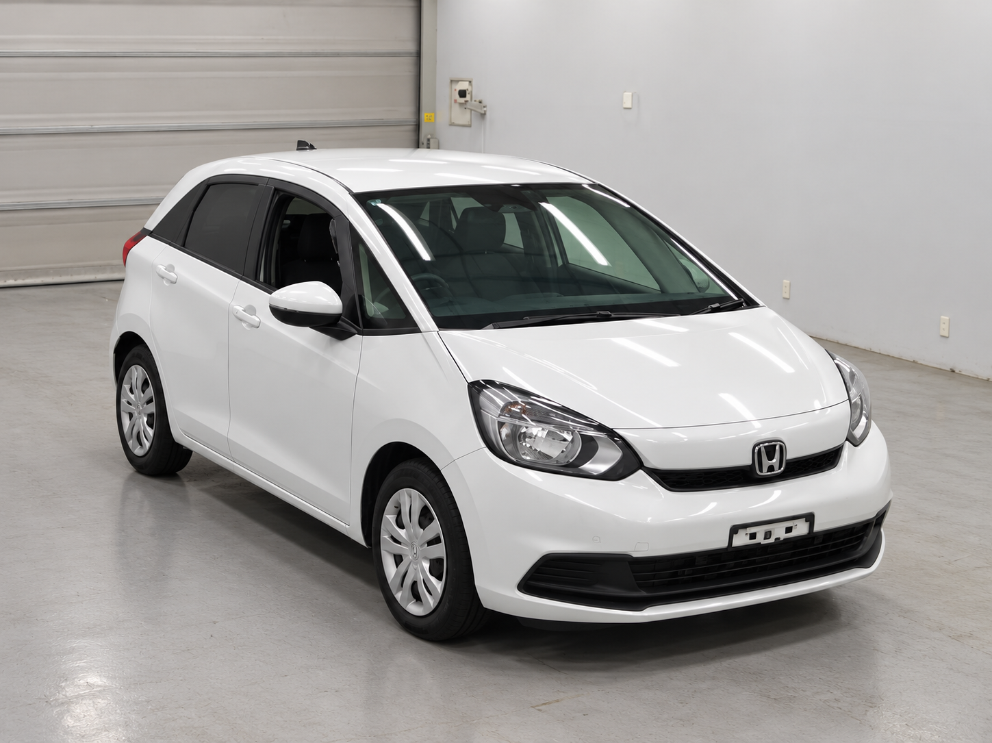 White Honda Hatchback Showroom Photo